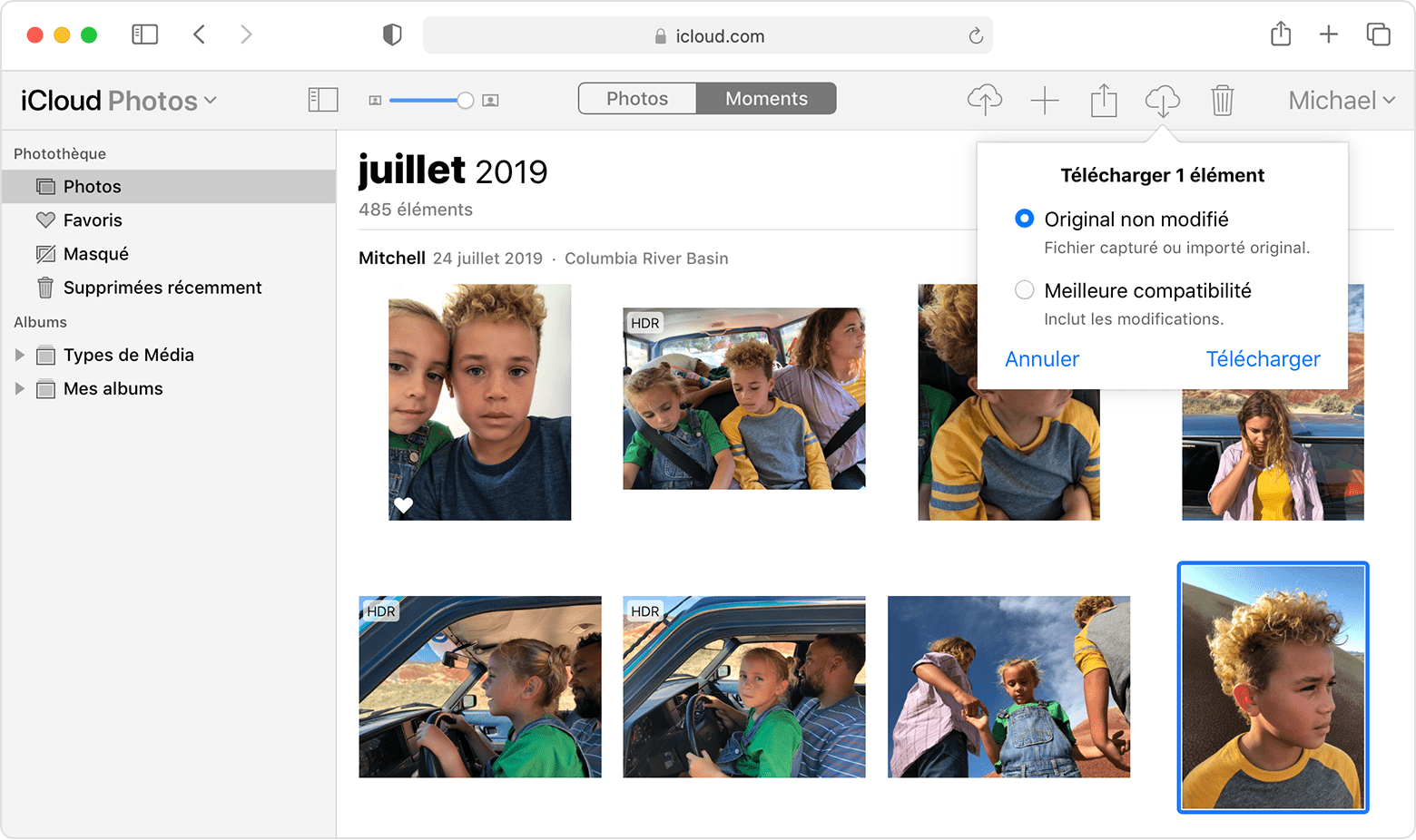 نافذة متصفح Safari تعرض خيارات تنزيل صور iCloud